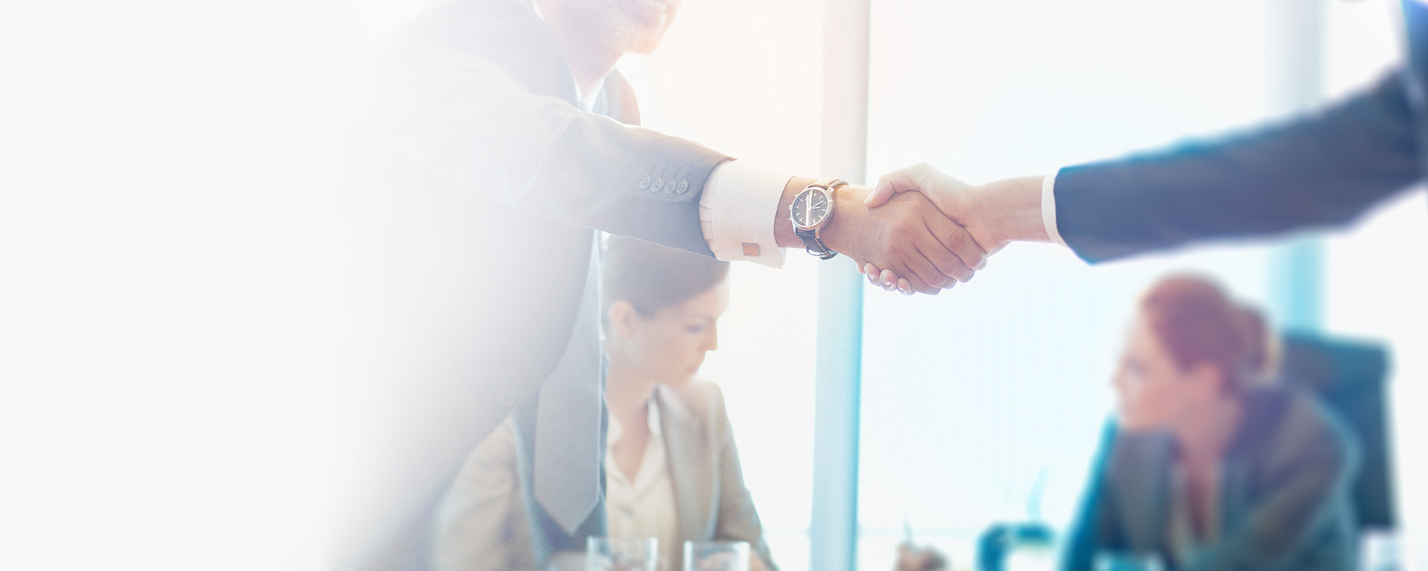 Our funding Photo of professionals shaking hands